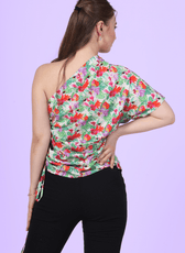 Back view of a model wearing the one shoulder kimono top paired with trousers