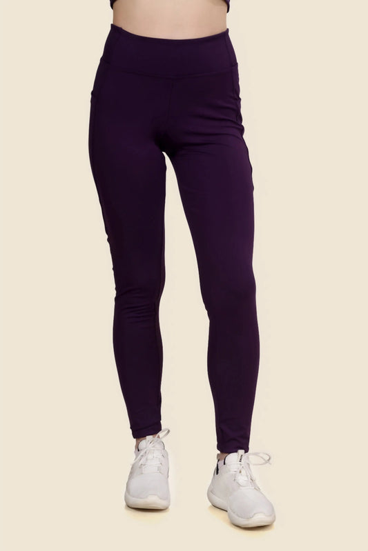 Front view of high-waisted running leggings made using the Layla sewing pattern. Features a snug fit and side pockets, ideal for workouts and casual wear.