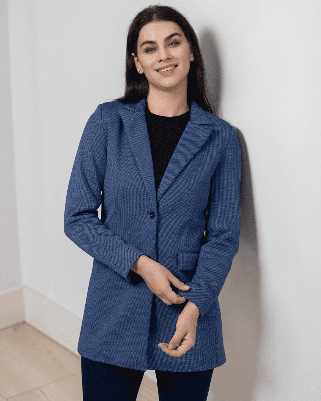 Model in blue blazer with structured shoulders and tailored fit, suitable for sewing pattern