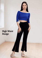 Model wearing black bell bottom pants with front slits and high waist sewing pattern