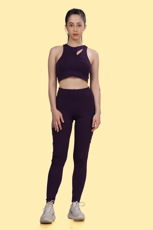 Model wearing the 'Layla' activewear coord set, showcasing a cutout sports bra and high-waisted leggings. Perfect for workouts with a snug, supportive fit.