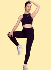 Model demonstrating the flexibility of the 'Layla' activewear coord set, featuring a cutout sports bra and high-waisted leggings for maximum movement.
