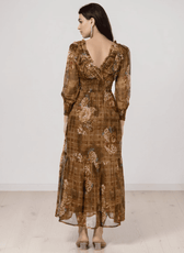 Back view of floral tiered maxi dress with ruffled V-neck
