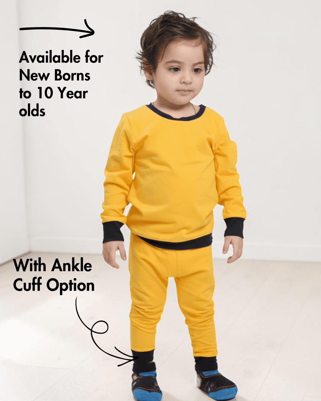 Young boy in yellow sweatshirt and matching joggers with ankle cuff option, illustrating Kid's Jogging Pants Sewing Pattern for ages 0-10