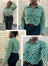 Women in green geometric patterned button-up shirt with cropped style, long sleeves, and high-waisted black pants