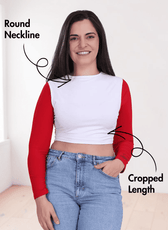 Woman wearing long sleeve crop top with round neckline and cropped length