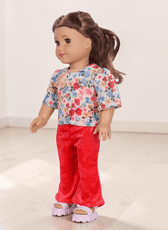 Doll with floral top and red flared pants, pink sandals sewing pattern