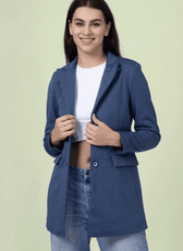 Close-up of the 'Camille' straight-cut coat sewing pattern. The model highlights the structured fit, notched lapel, and buttoned front closure of the design.