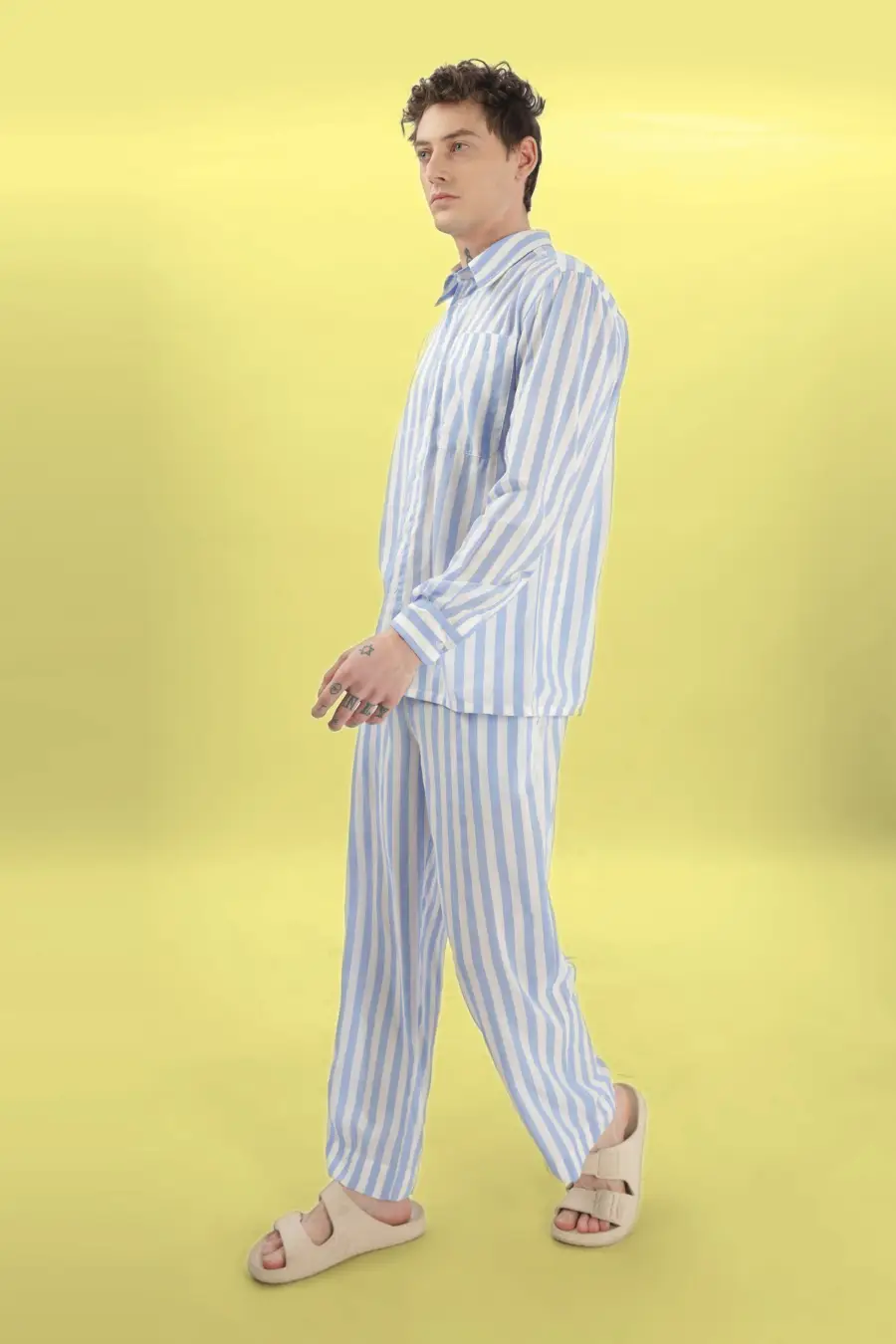 Side profile of a model in the 'Arbor' men's pajama set. A comfortable and stylish loungewear sewing pattern available in multiple sizes.