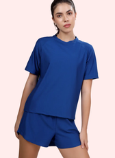 Model posing in the 'Maria' activewear coord set, highlighting the breathable fabric and relaxed silhouette. Perfect for fitness and everyday wear.