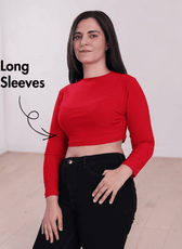 Close Up of Woman wearing long sleeve crop top with round neckline and cropped length