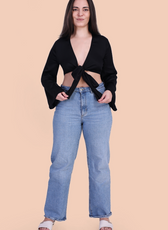 Front Pose Image of a model wearing a tie front crop top sewed with winslet's patterns paired with blue jeans