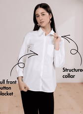 Woman wearing white classic shirt with structured collar, full front button placket, and long sleeves