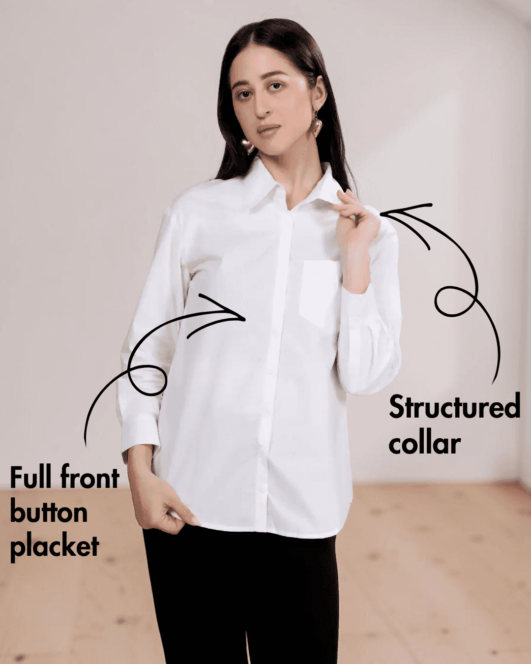 Woman wearing white classic shirt with structured collar, full front button placket, and long sleeves
