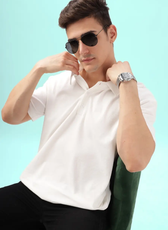Casual men's polo shirt sewn using the 'John' pattern. Model adjusts the collar, showcasing the comfortable fit and high-quality fabric choice.