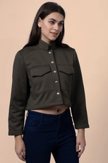 Angled view of the 'Noelle' short jacket, displaying its structured silhouette, button closure, and practical chest pockets.