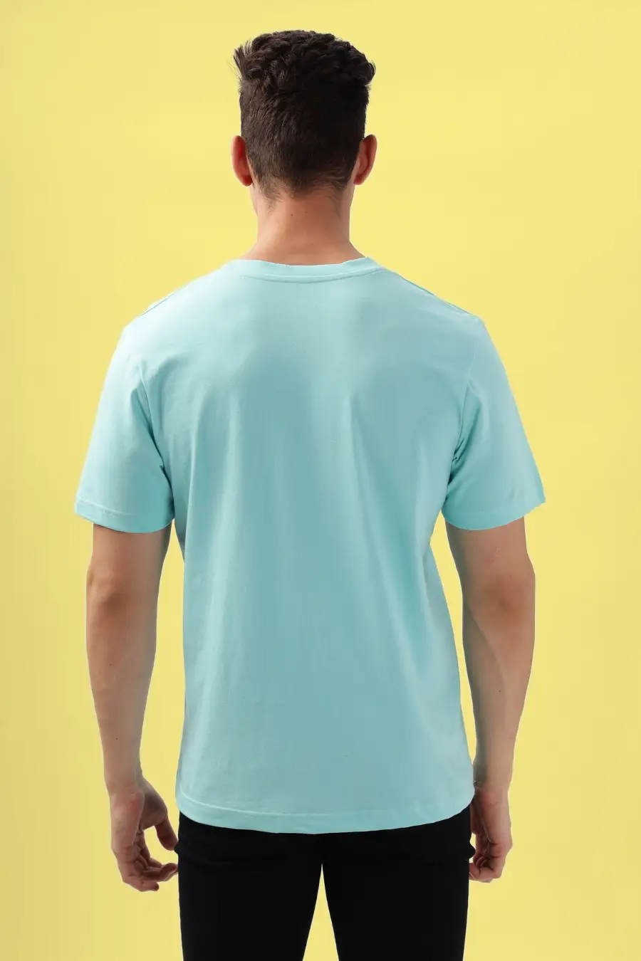 Back view of men's round neck T-shirt in light blue. Features a clean-cut design with short sleeves and a straight hem.