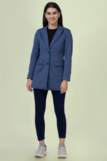 Model wearing the 'Camille' straight-cut coat with leggings. The structured coat features a notched lapel, single-breasted closure, and flap pockets for a polished look.