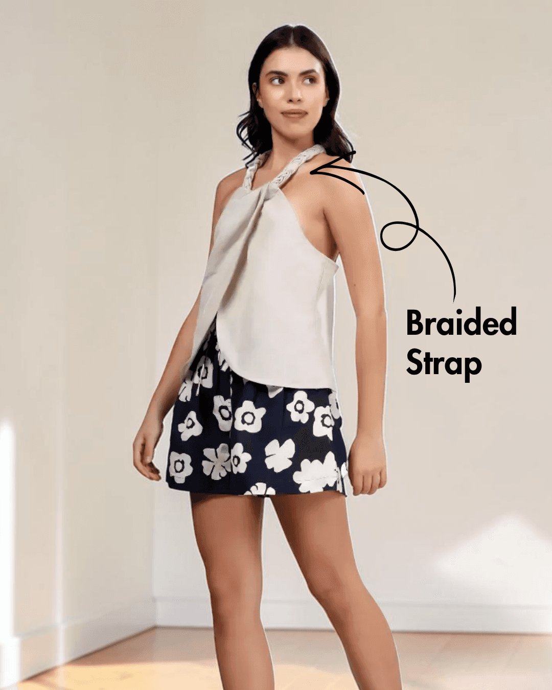 Model wearing halter neck top and floral high-waisted shorts in sewing pattern