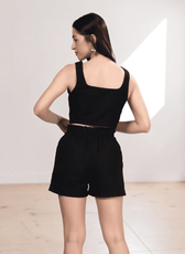 Black crop top and high waisted shorts sewing pattern with button details, back view