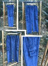 Model wearing black cargo sweatpants with cargo pockets and elastic waistband