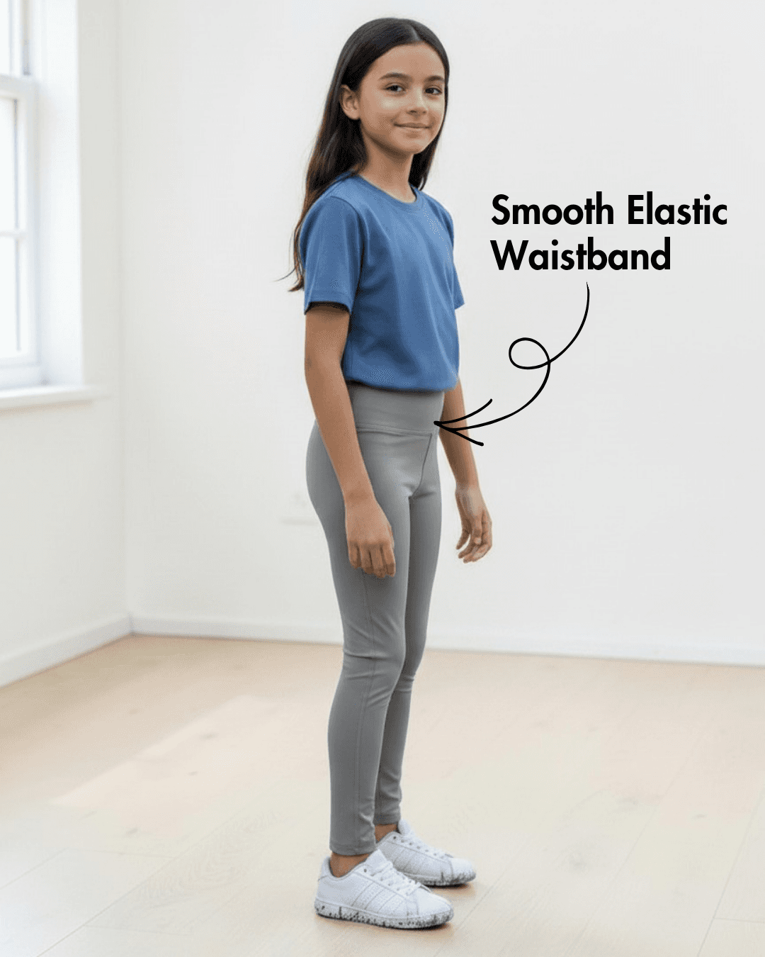 Side view of girl in blue T-shirt and gray leggings with smooth elastic waistband, highlighting Kid's Leggings Sewing Pattern Avery