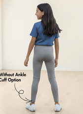 Back view of girl in gray leggings with elastic waistband, showing fit and style of Kid's Leggings Sewing Pattern Avery