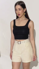 distance shot of a model wearing a high-waisted shorts sewing pattern