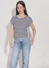 Model wearing striped T-shirt with relaxed fit and casual style