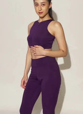 Model showcasing Layla running leggings in motion. High-waisted, stretchy leggings with side pockets, designed for activewear and comfort.