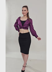 Model posing in the Front Knot Top 'Willow' with a black skirt, highlighting the stylish front knot and flattering silhouette.