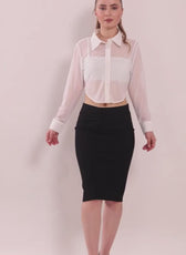 Model wearing white cropped shirt with long sleeves and button front