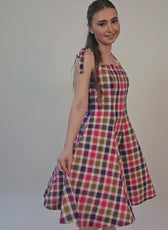 Video of a model posing in a sleeveless midi dress sewed with winslet's patterns