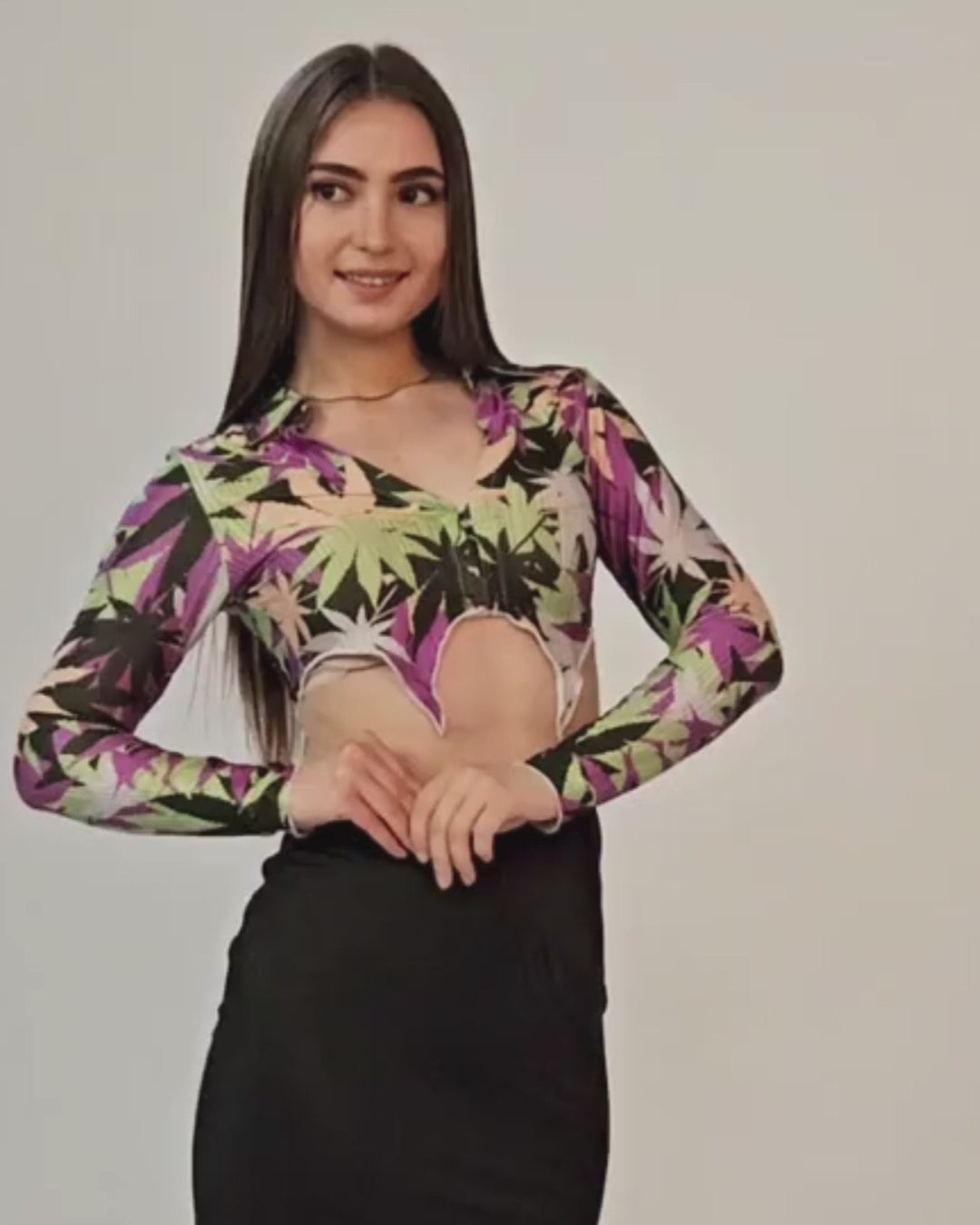Video of Model wearing pointed hem crop top with long sleeves and collar