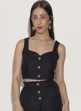 Model wearing black crop top and high waisted shorts Harper sewing pattern