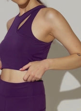 Close-up of Layla cutout sports bra in motion. The fitted design and stretch fabric ensure comfort and flexibility for active and casual wear.