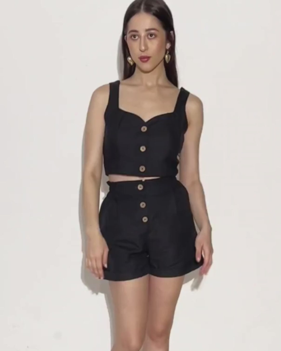 Model wearing black crop top and shorts set for sewing pattern 'Harper'