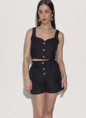 Model wearing black crop top and shorts set for sewing pattern 'Harper'