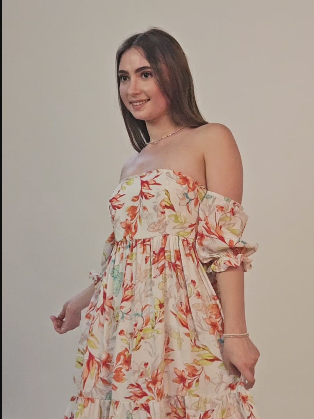 Video of model wearing an off shoulder dress sewed with winslet's pattern