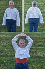 Customer wearing a white Selena sweatshirt with colorful polka dots, showing front, back, and movement flexibility of the design.